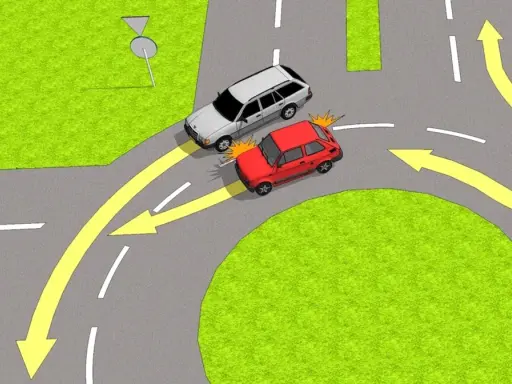 Zjazd z ronda z lewego pasa. Czerwony samochód wymusił pierwszeństwo na srebrnym kombi, które miało prawo jazdy.