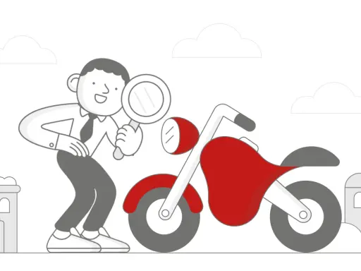 Mężczyzna z lupą dokonuje przeglądu motocykla.